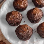 Fudgy brownie bites on a white plate